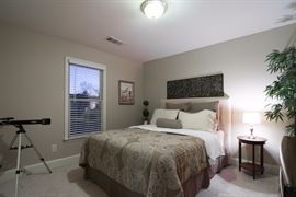 Double bed set with fabric headboard.