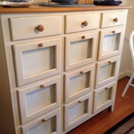 PANTRY CABINET WITH DISPLAY FRONT DRAWERS.