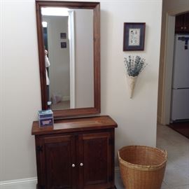 2 DOOR CABINET, MIRROR, AND NEAT WOVEN BASKET