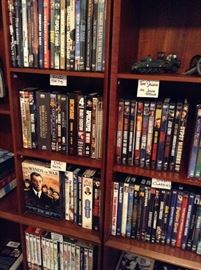 This shows two bookcase tops sitting side by side.  Notice great choice of movies to watch this February...remember winter is about to start. 

