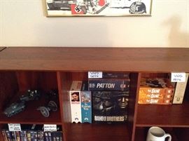 The top of the middle cabinet.