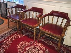 Now these are cool, wood and leather, deep fire engine red, Captain's Chairs