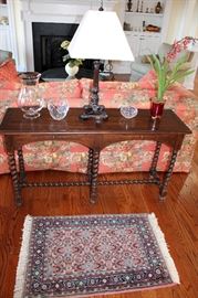 Barley twist sofa table, small Oriental rug, crystal, table lamp