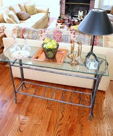 Glass-top iron sofa table, brass items, glassware, table lamp