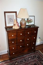 Chest, pottery lamp, artwork