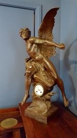 Cast Metal Patinated Figural Clock, Depicting a Winged Figure on a Rock, Titled on Base, ''La Pensee Brisant Ses Chaines'' signed E. Picault