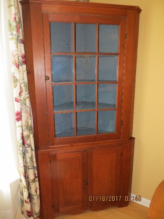 19th Century Pennsylvania two piece corner cupboard, with original  paint in the interior