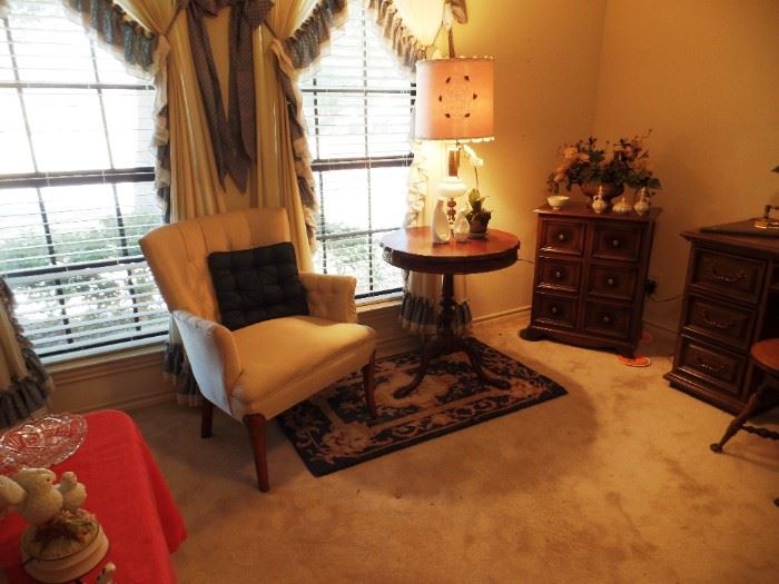 view of cozy reading nook with side chair and antique table