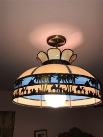 Antique Egyptian themed stained glass hanging lamps. There are two of these and a table top lamp. 