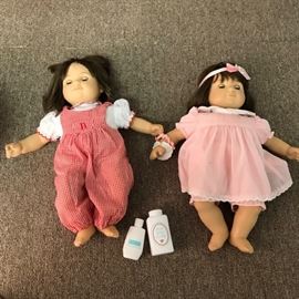 Girl twin brunette Bitty Babies, one doll had had hair cut.