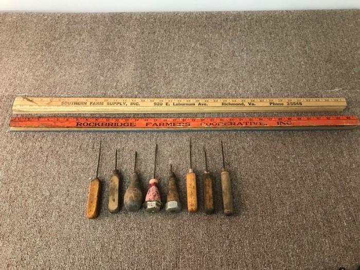 Vintage set of yardsticks and ice pick