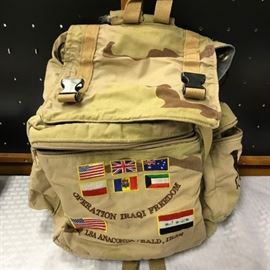 Military backpack - Operation Iraqi Freedom with patches and flags.