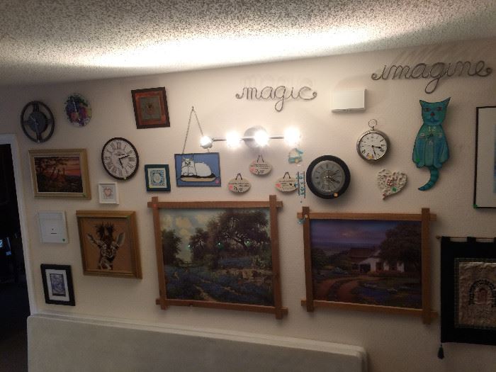 Clocks & artwork including two needlepoint giraffe pieces