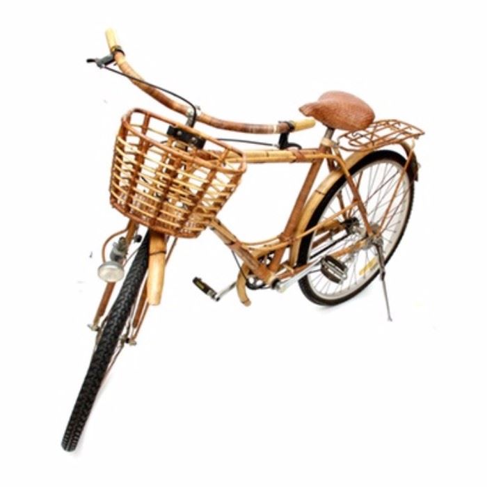 Vintage 1940s Rattan Bicycle: A vintage 1940s rattan bicycle. The unique bicycle is composed of a rattan frame and woven wicker accessories. Additional features of the bike are a rack above the back wheel, kickstand, basket, hand brake, and a light to the front.