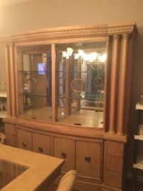 Curved front lighted China with storage below. Extremely heavy but it is two pieces. Bring your mover!