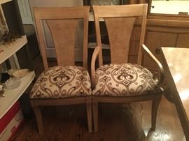 There are 4 side chairs and 2 captains arm chairs. Seats are in beautiful condition!