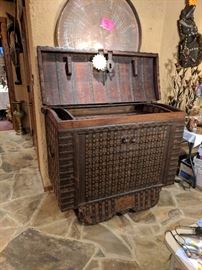 Circa mid 19Th C&nbsp;India Origin Teak, Brass & Iron Dowry Chest with Wood Wheeled Feet. &nbsp;Bound in Iron and Brass with Brass decoration to the front and domed lid , heavy iron hardware complete this fabulous piece. from Northwest India. 42.5"Hx 49"W x 30.5"D. &nbsp;Beautiful inside and out. 3500.00