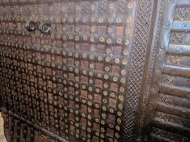 Circa mid 19Th C&nbsp;India Origin Teak, Brass & Iron Dowry Chest with Wood Wheeled Feet. &nbsp;Bound in Iron and Brass with Brass decoration to the front and domed lid , heavy iron hardware complete this fabulous piece. from Northwest India. 42.5"Hx 49"W x 30.5"D. &nbsp;Beautiful inside and out. 3500.00