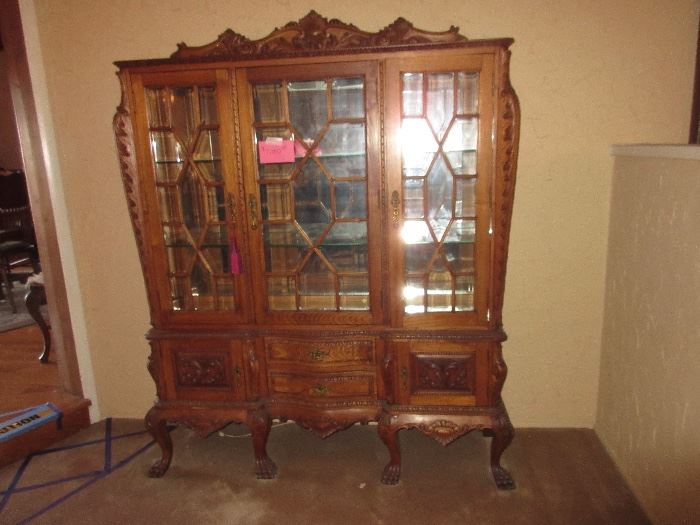 heavily carved over large china cabinet