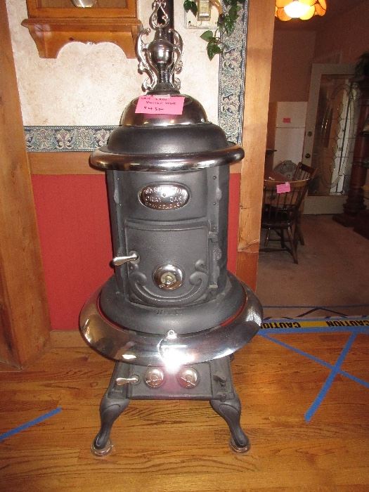 In beautiful condition, a cast iron parlor stove