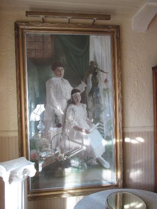 this is the fabulous very large Victorian framed tinted photo. This piece is sitting on the floor, about 6 ft. tall
