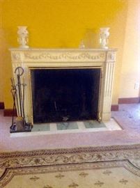 Antique carved marble fireplace mantle, pair of mantle lusters, fireplace tools, andirons and firescreen