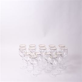 Lenox Crystal "Monroe" Gold Trim Wine Glasses: A collection of gold-rimmed Lenox crystal stemware. This set is in the “Monroe” pattern and includes 10 water goblets and six wine glasses.