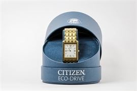Citizen Eco-Drive Stiletto Men’s Wristwatch: A gold-tone Citizen Eco-Drive Stiletto men’s wristwatch featuring a white rectangular dial with gold tone Roman numerals.