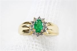 14K Yellow Gold Emerald and Diamond Ring: A 14K yellow gold emerald and diamond ring.