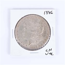1886 Uncirculated Morgan Silver Dollar: An 1886 Morgan silver dollar. An 1886 Silver Morgan Dollar. Designer: George T. Morgan. Mintage: 19,963,886. Metal Content: 90% silver, 10% copper. Diameter: 38.1 mm. Weight: 26.7 grams