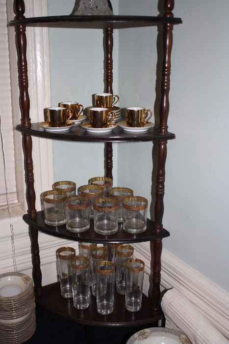 corner cabinet, good condition, with very nice glassware, tea cups, and saucers.