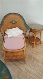 Wicker chair with Ottoman and matching side table.