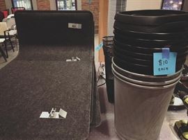 sound-absorbing privacy panels and lots of little trash cans