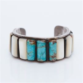 Signed Navajo Sterling Turquoise and Mother-of-Pearl Cuff: A signed Navajo sterling silver cuff bracelet with turquoise and mother-of-pearl tablets.