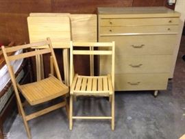 Assorted wood furniture including dressers folding chairs and tables