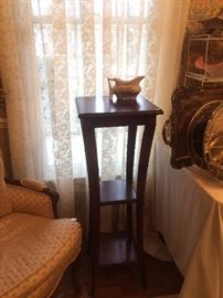 One of two matching 3-tiered plant stand