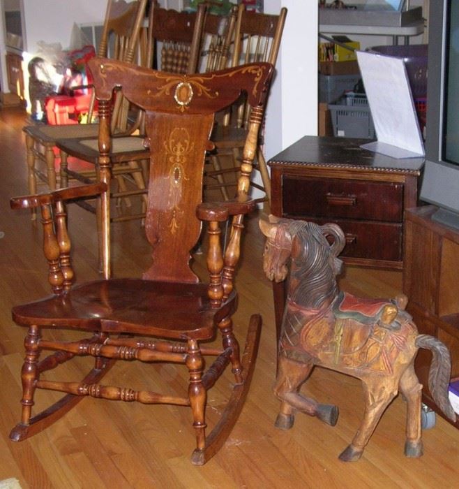 Rocking chair with marquetry design. Wood horse.