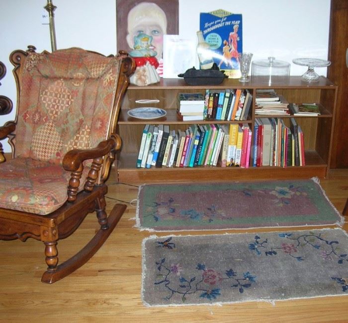 Books, antique Chinese rugs.