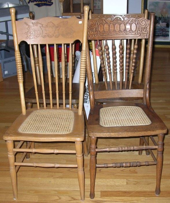Oak Pressed Back chairs, some with cane seats.