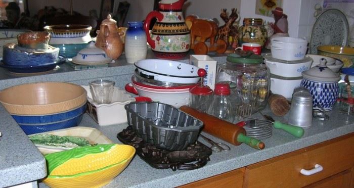 Kitchen is loaded! Tons of mixing bowls, vintage gadgets, cast iron molds
