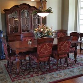 Dining room suite has 3 leaves, 8 chairs, rippled glass in the china cabinet, and a marble topped buffet