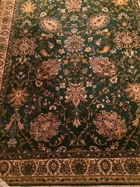 4 feet 7 inches x 6 feet 6 inches rug in tan, brown, and green