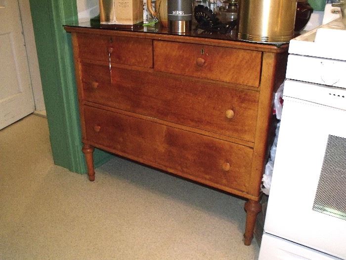 Glass top antique dresser in kitchen