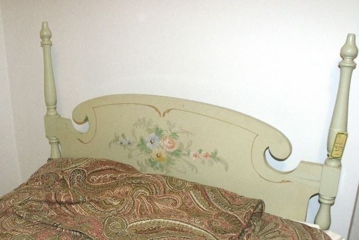 One of a pr of decorated single beds