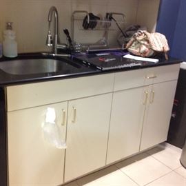 Cabinet, sink and shelving 