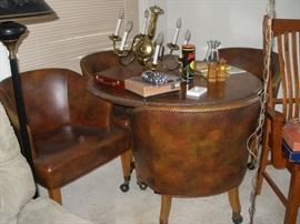game table, 4 leather chairs, brass chandelier