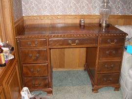 mahagany desk w/ leather inlaytopfinished all around