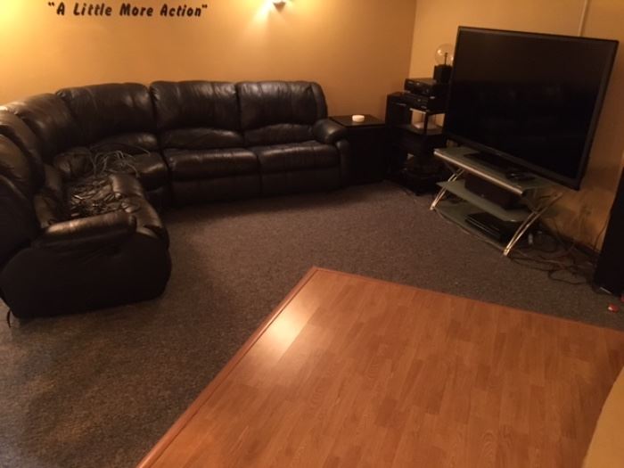 NAVY BLUE SECTIONAL COUCH WITH SLEEPER SOFA ON ONE END AND RECLINER ON THE OTHER END. PULL DOWN TABLE/DRINK HOLDER NEXT TO RECLINER SEAT
