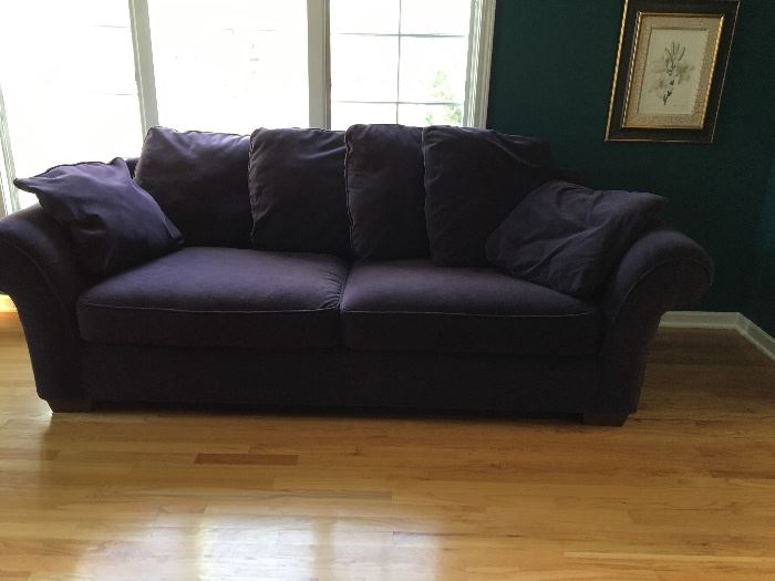 PLUM COLORED COUCH WITH LOTS OF CUSHIONS AND MATCHING CHAIR