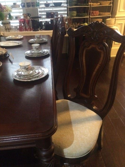 One of the eight dining chairs